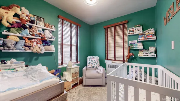 a bedroom with furniture and a window