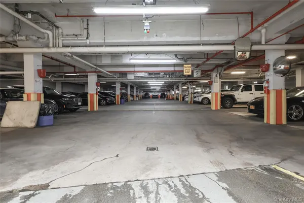 a view of parking garage with cars
