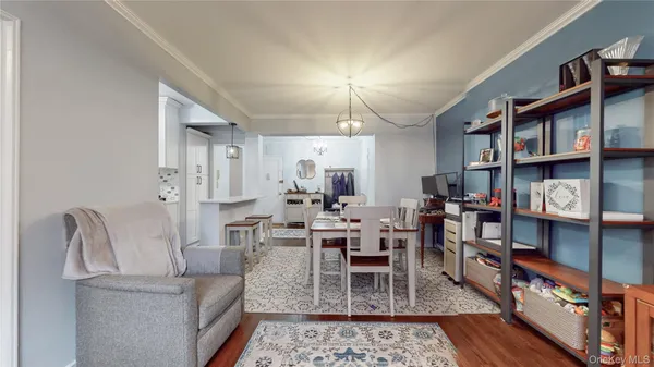 a living room with furniture and a book shelf