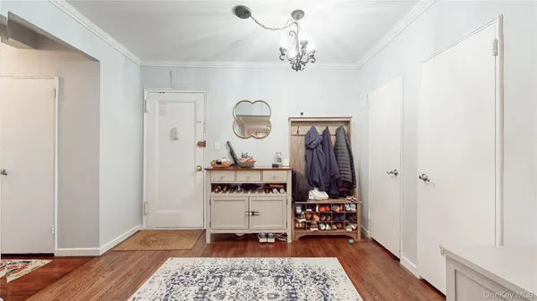 a view of room with furniture and wooden floor