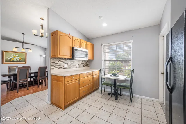 a kitchen with stainless steel appliances kitchen island granite countertop a sink and cabinets