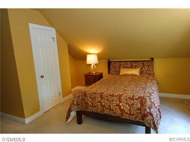 2341 Banstead Road Midlothian, VA 23113 - Photo 13 of 19 a bedroom with a bed and wooden floor