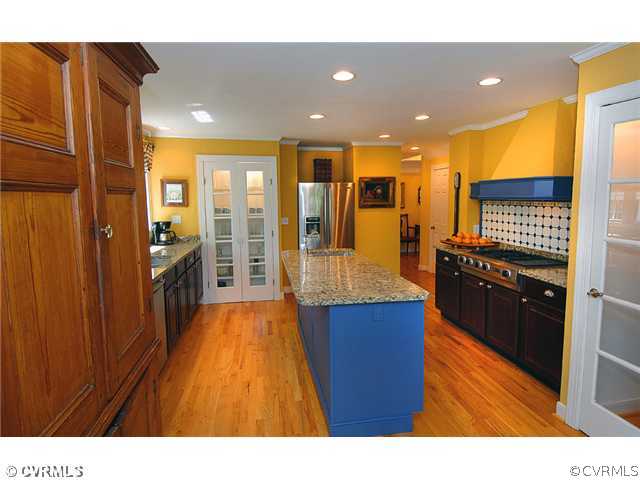 2341 Banstead Road Midlothian, VA 23113 - Photo 6 of 19 a open kitchen with stainless steel appliances granite countertop a stove a refrigerator a sink and dishwasher with wooden floor
