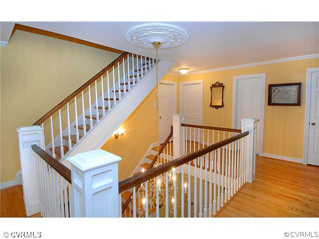 2341 Banstead Road Midlothian, VA 23113 - Photo 9 of 19 a view of staircase with wooden floor and windows