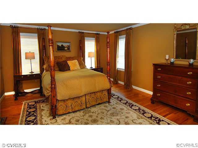 2341 Banstead Road Midlothian, VA 23113 - Photo 10 of 19 a bedroom with a bed and wooden floor
