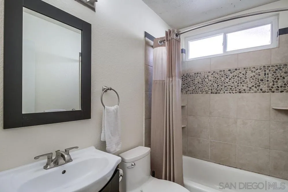 10545 Cadwell Road Santee, CA 92071 - Photo 18 of 22 a bathroom with a sink toilet and shower