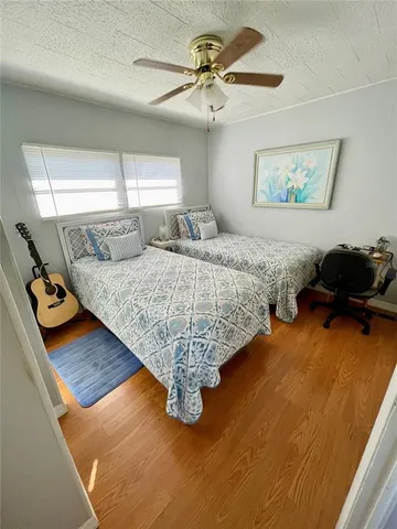 a bedroom with bed and window