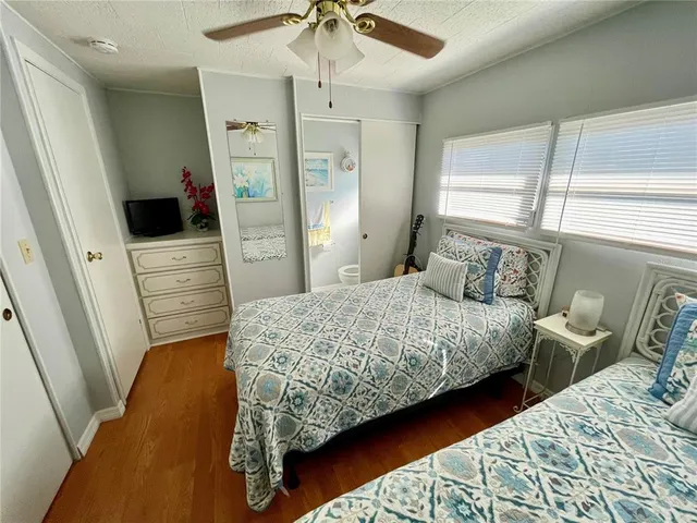 a bedroom with a bed and a walk in closet