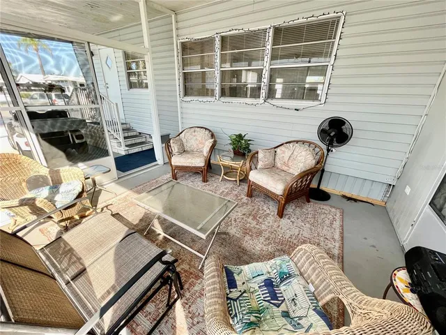 a view of a living room and dining room with furniture
