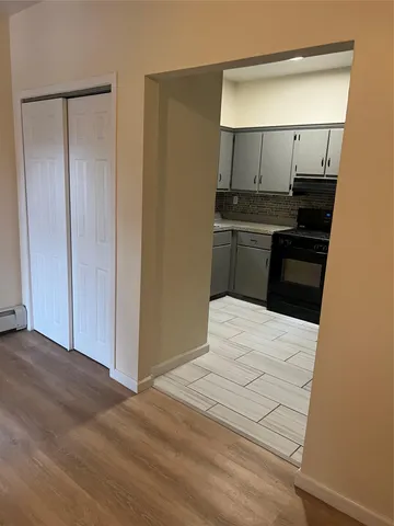 a kitchen with granite countertop a refrigerator and a sink