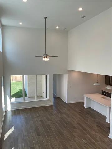 a large kitchen with a large counter top appliances and cabinets