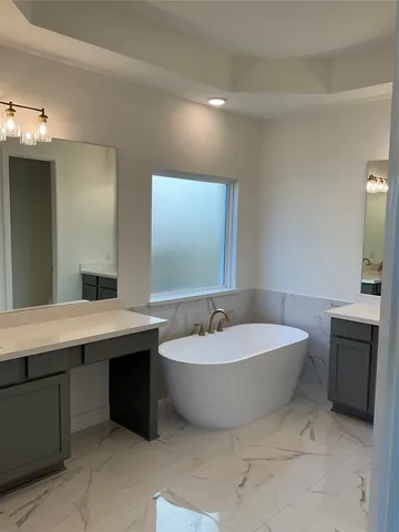 a bathroom with a shower and a sink
