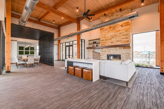 a view of a swimming pool with outdoor seating