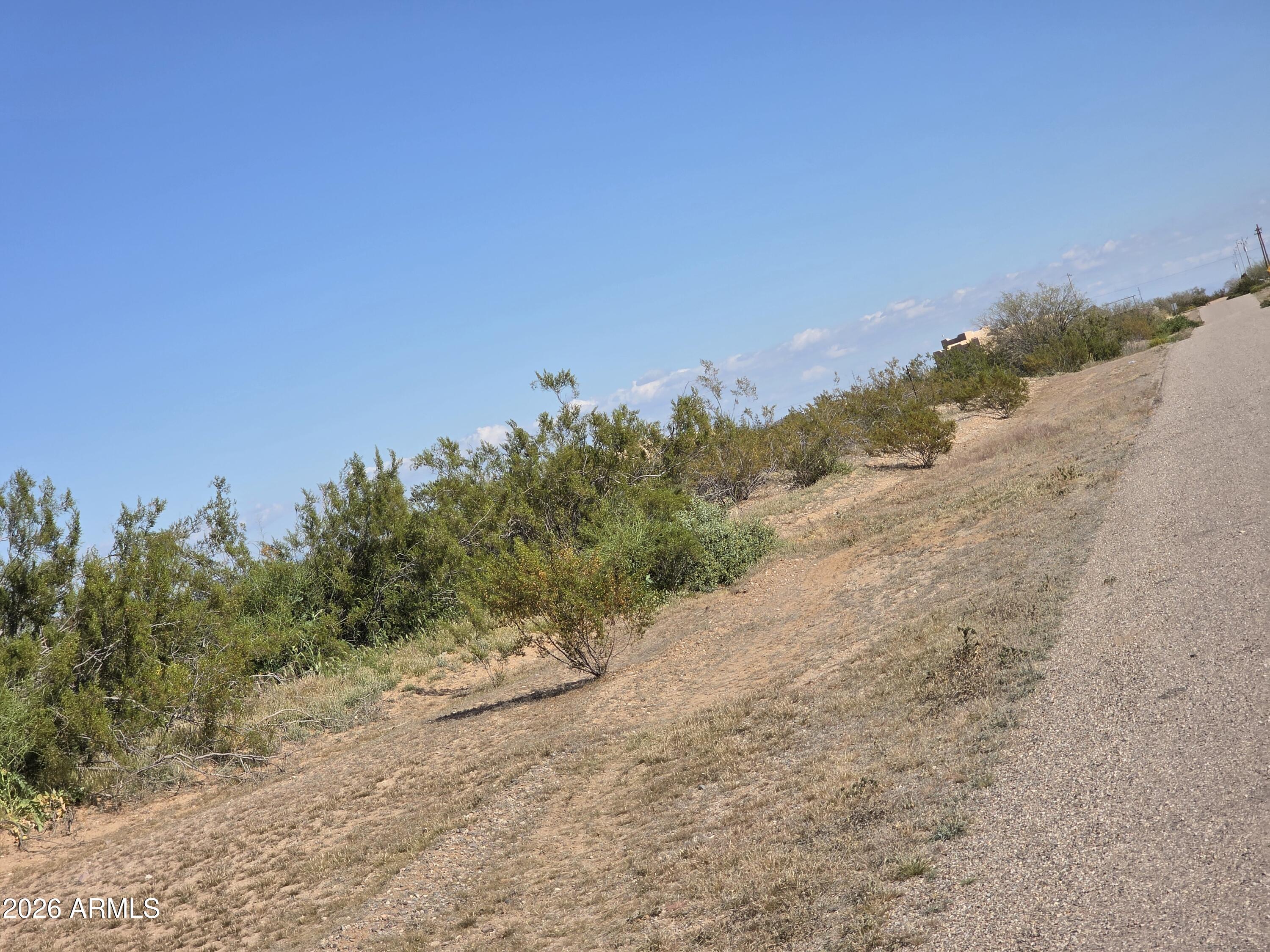 19300 West Roadrunner Road Wittmann, AZ 85361 - Photo 40 of 102 a view of a road with a beach