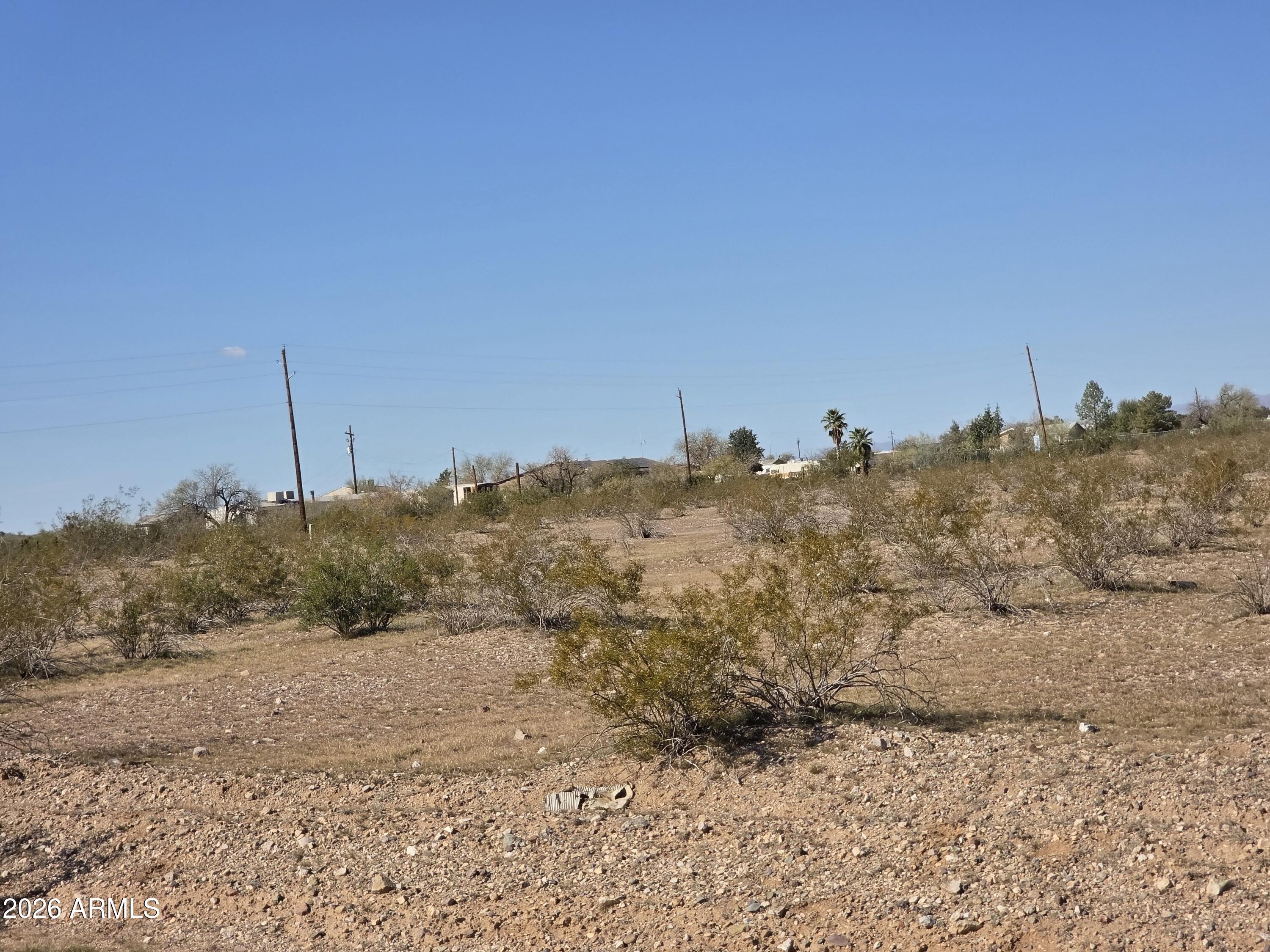 19300 West Roadrunner Road Wittmann, AZ 85361 - Photo 48 of 102 a view of a road with a mountain in the background