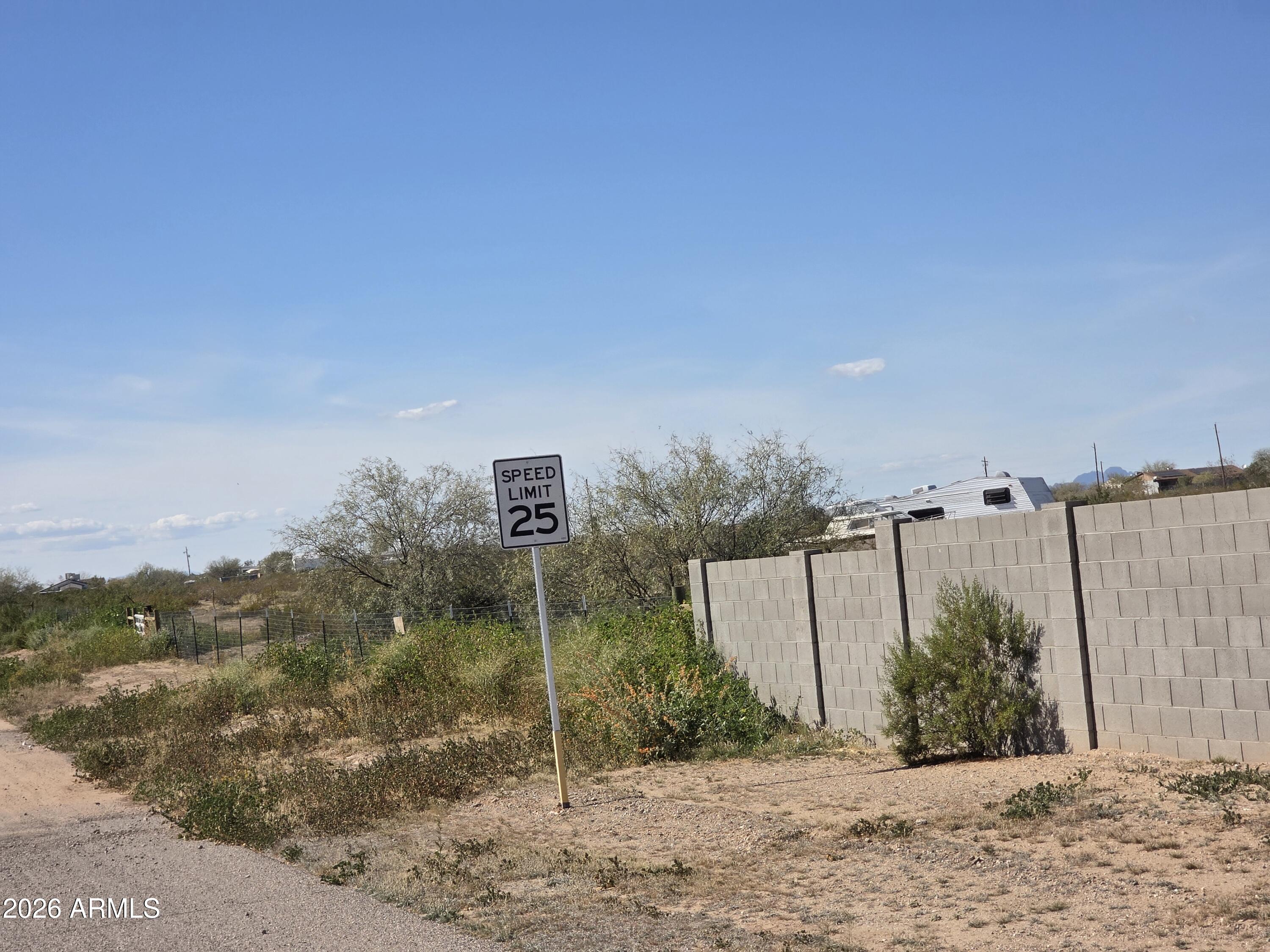 19300 West Roadrunner Road Wittmann, AZ 85361 - Photo 60 of 102 a backyard of a house with lots of green space