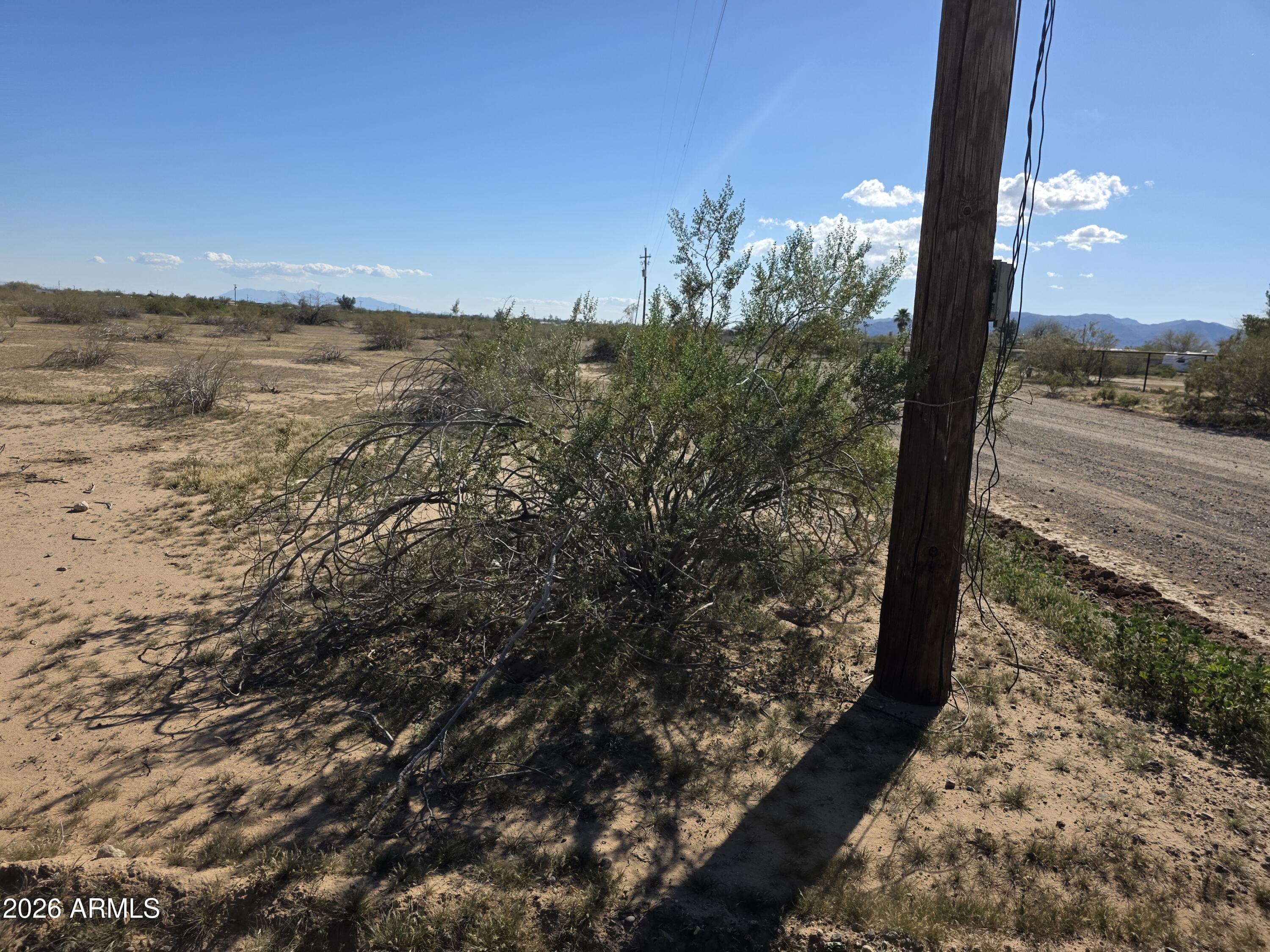 19300 West Roadrunner Road Wittmann, AZ 85361 - Photo 93 of 102 a view of a city street from a yard