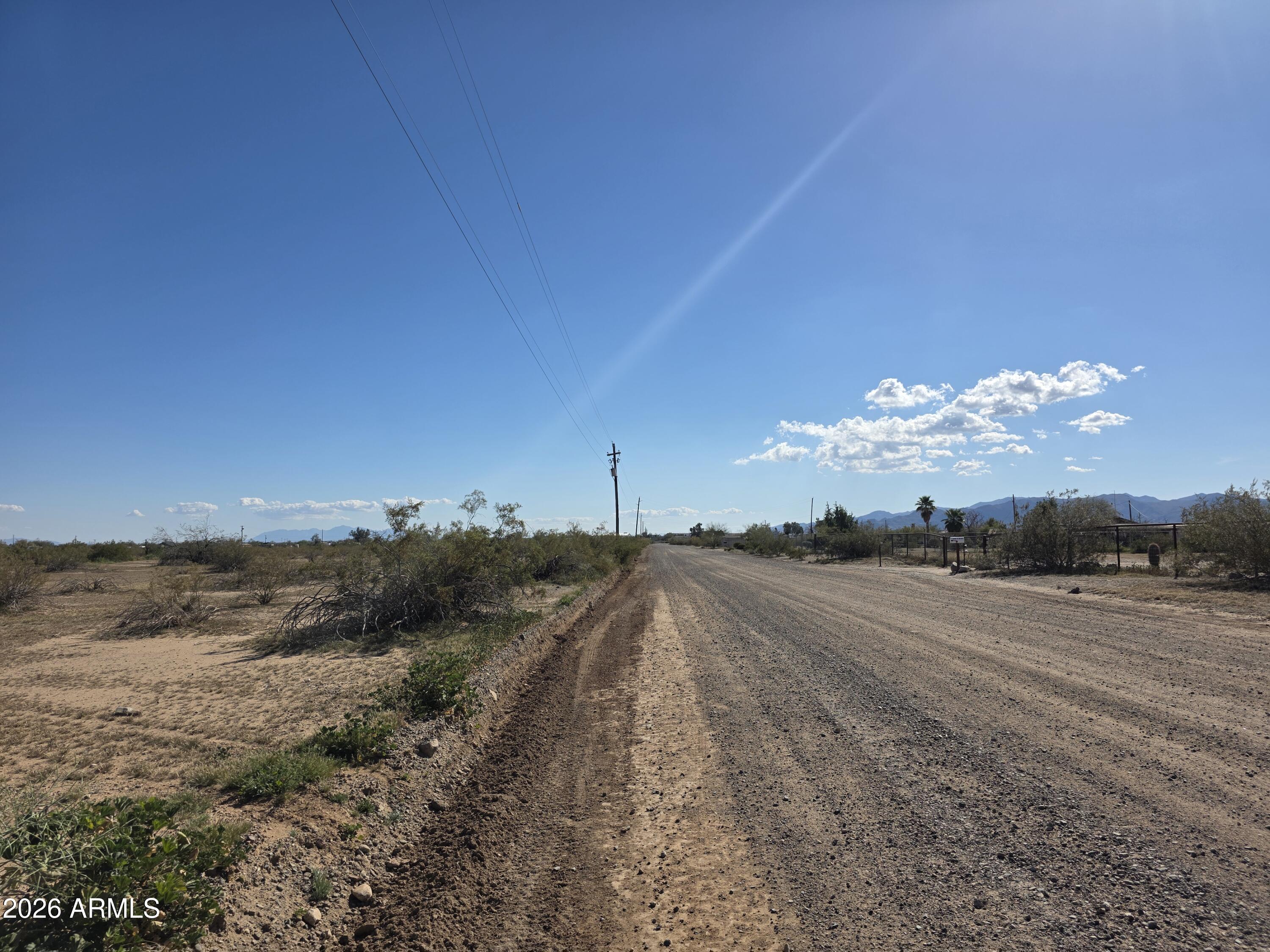 19300 West Roadrunner Road Wittmann, AZ 85361 - Photo 96 of 102 a view of a road with an ocean view