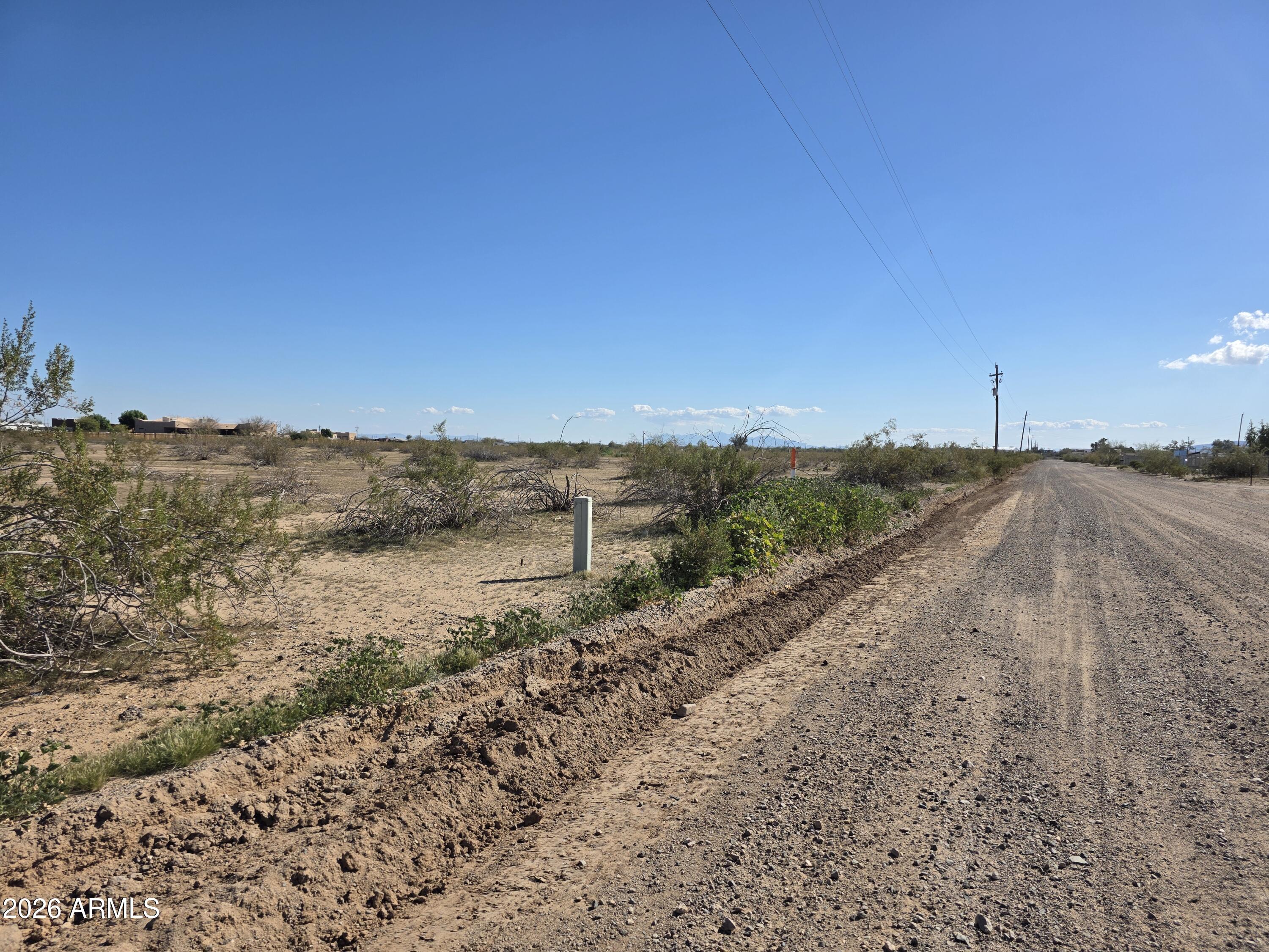 19300 West Roadrunner Road Wittmann, AZ 85361 - Photo 99 of 102 a view of a road with an ocean view