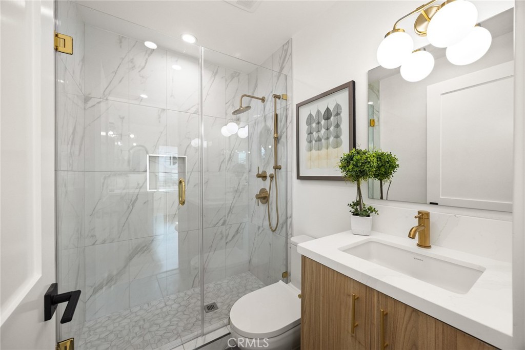 905 Sunset Boulevard, Unit A Arcadia, CA 91007 - Photo 14 of 35 a bathroom with a sink toilet and shower