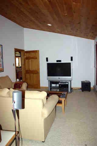 417 Fred Snow Road Becket, MA 01223 - Photo 4 of 10 a living room with furniture and a flat screen tv