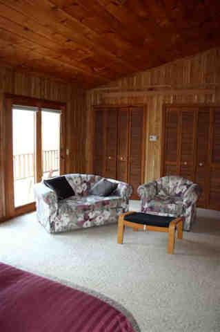 417 Fred Snow Road Becket, MA 01223 - Photo 5 of 10 a living room with furniture and a large window