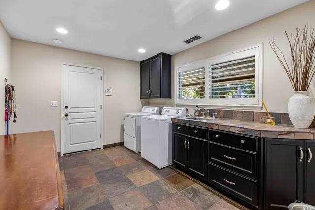 a kitchen with a stove and a sink