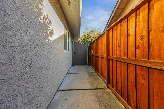 a view of balcony with wooden floor and stairs
