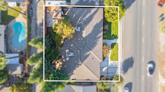 an aerial view of a house with swimming pool