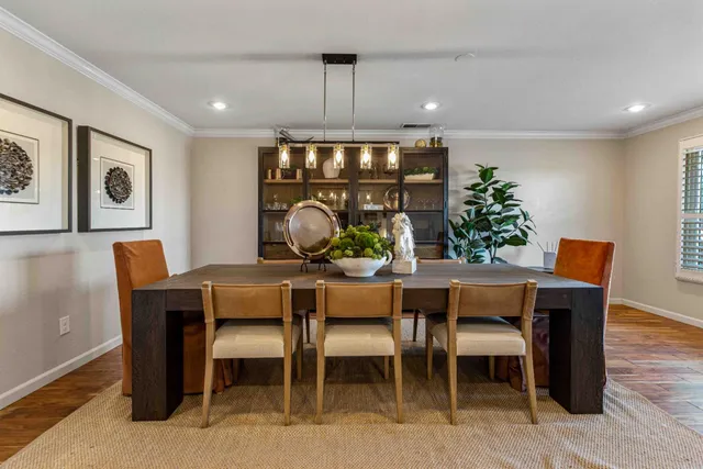 a view of a dining room with furniture window and wooden floor
