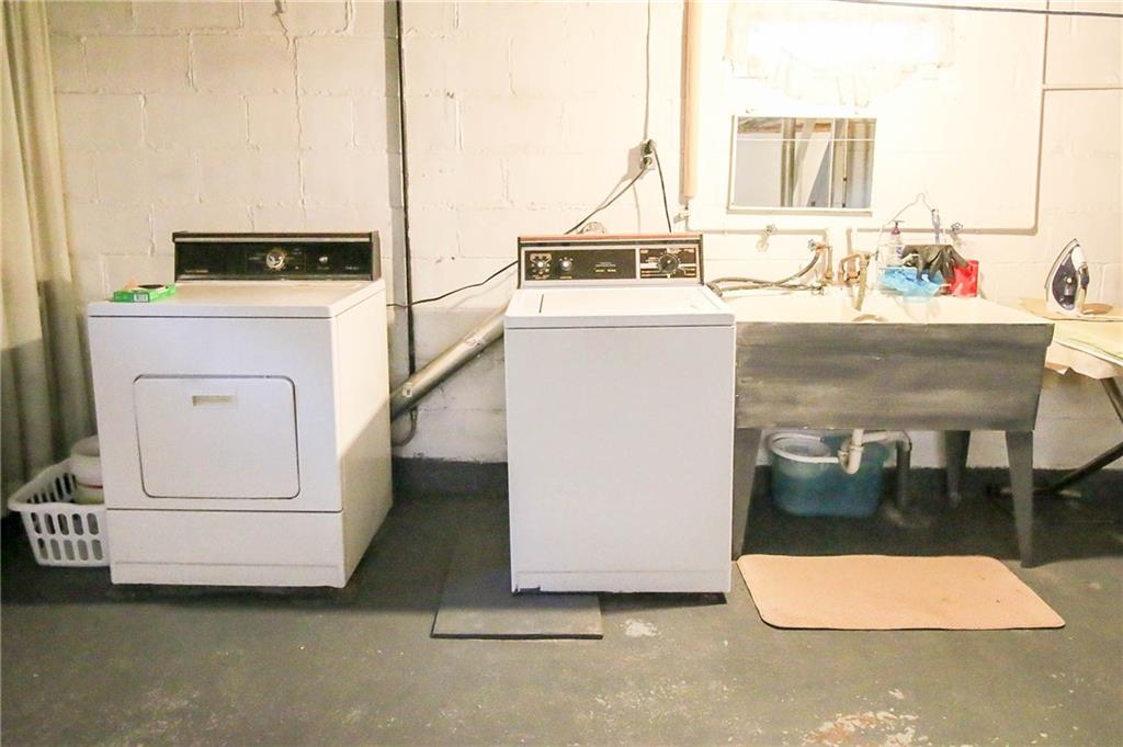 2859 Beaver Road Ambridge, PA 15003 - Photo 14 of 20 Washer and dryer and laundry tub.