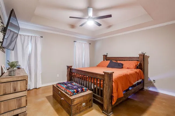 a bedroom with a bed and a dresser