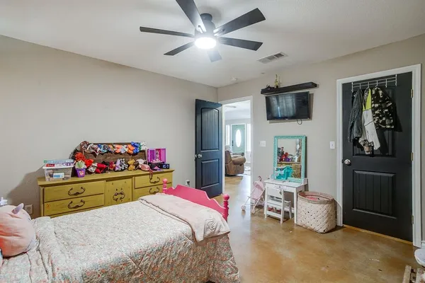 a bedroom with a bed and furniture