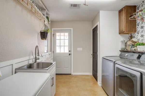 a kitchen that has a sink and a stove