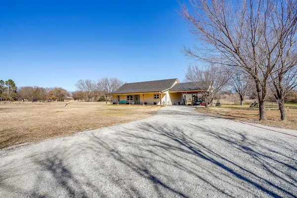 a view of city street with a house