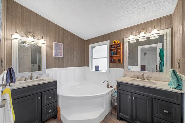 a view of a backyard with a garden and trees