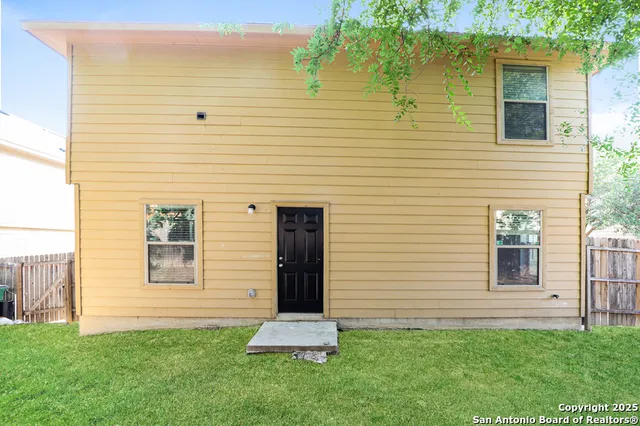 a view of a backyard of the house