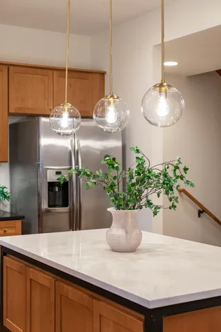 a view of a room with a chandelier furniture and potted plant