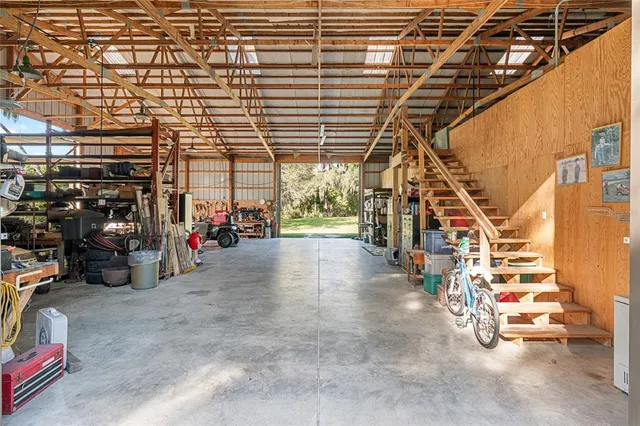 a view of swimming pool and deck in the backyard of house along with seating space