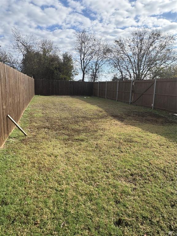 216 Cleveland Street, Unit B Cleburne, TX 76031 - Photo 25 of 26 a view of a backyard
