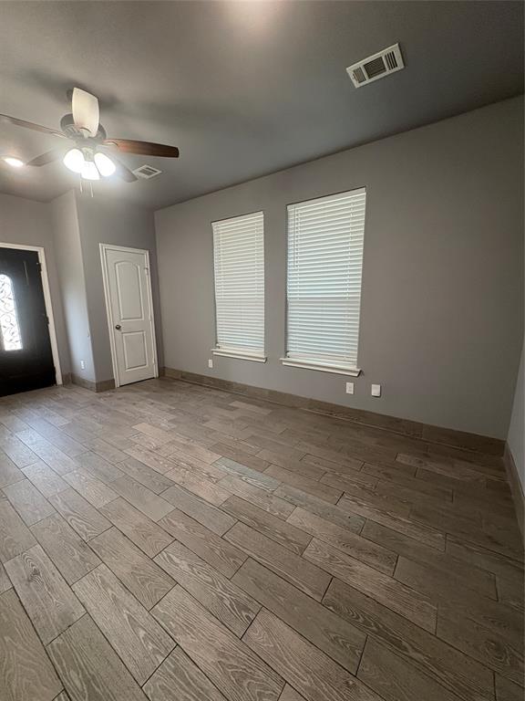 216 Cleveland Street, Unit B Cleburne, TX 76031 - Photo 4 of 26 a view of an empty room with a window