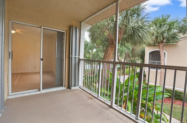 a view of a glass door and wooden floor