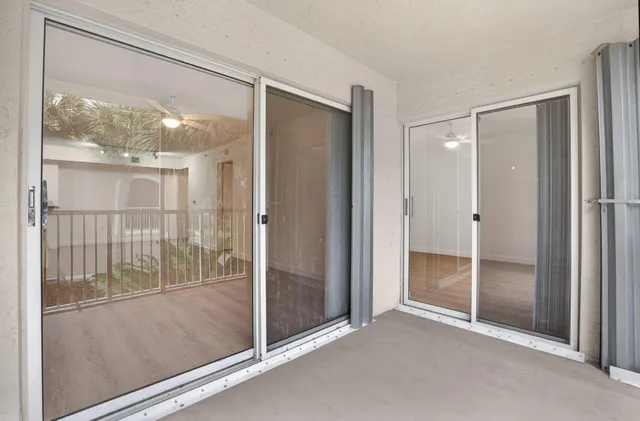 a view of empty room with windows