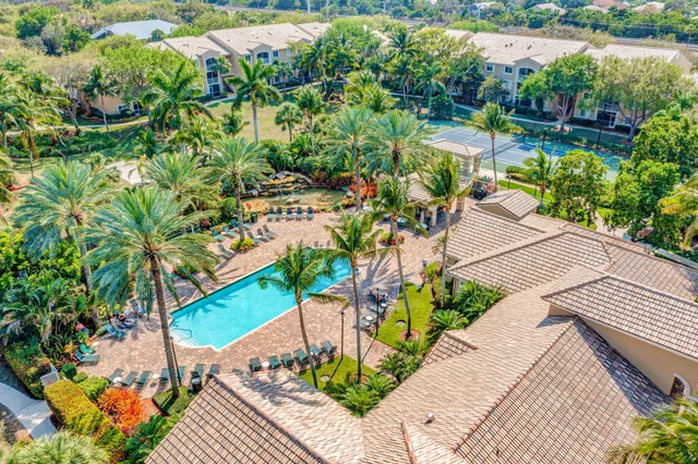 a view of a backyard with sitting area