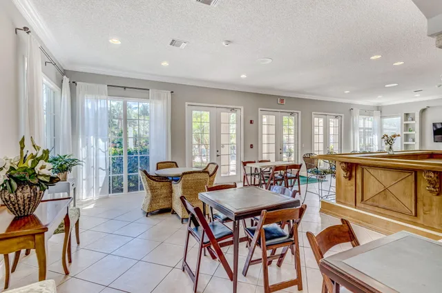 a view of a dining room with furniture window and outside view