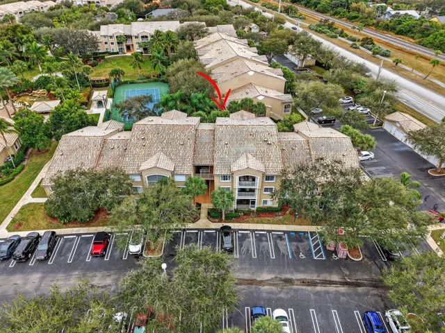 a view of a livingroom with wooden floor and furniture