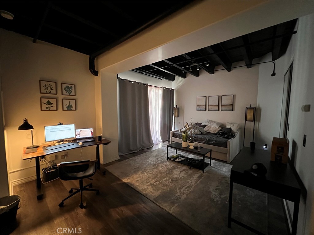 312 West 5th Street, Unit 1010 Los Angeles, CA 90013 - Photo 4 of 4 a bedroom with furniture and a window