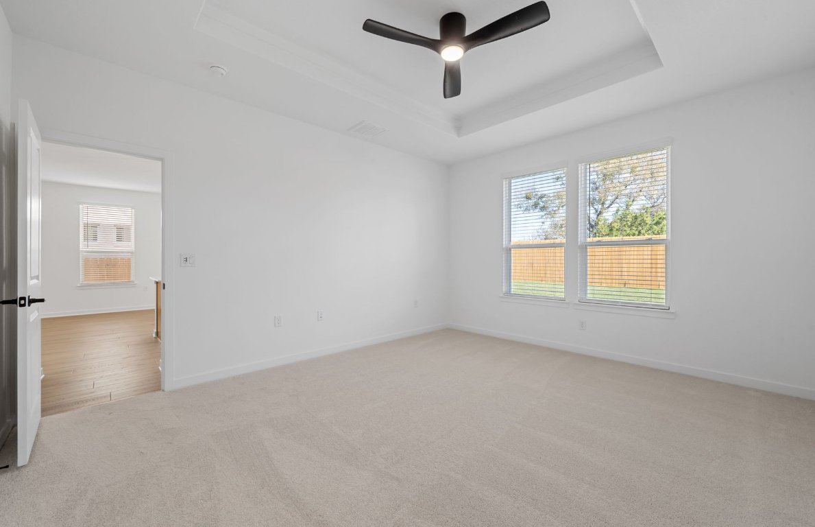 125 Adlai Avenue Georgetown, TX 78633 - Photo 16 of 32 an empty room with a ceiling fan and window
