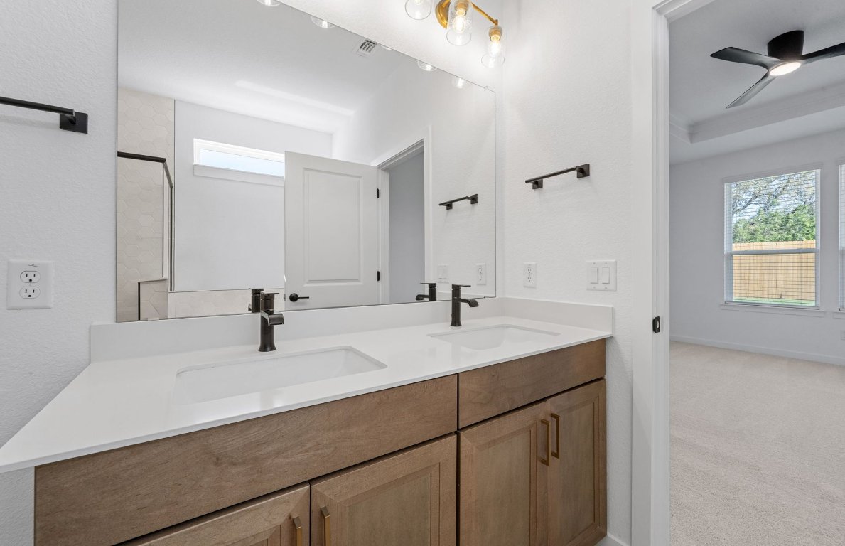 125 Adlai Avenue Georgetown, TX 78633 - Photo 18 of 32 a bathroom with a sink and a mirror