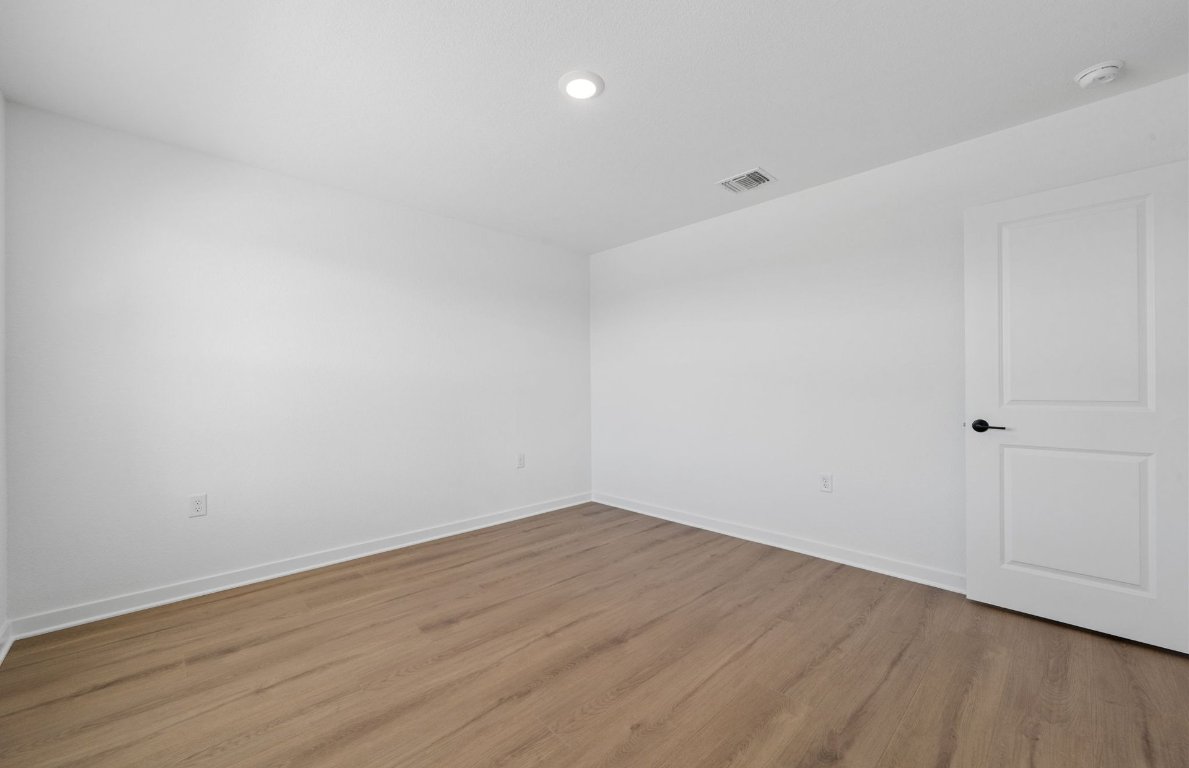 125 Adlai Avenue Georgetown, TX 78633 - Photo 23 of 32 a view of room with wooden floor